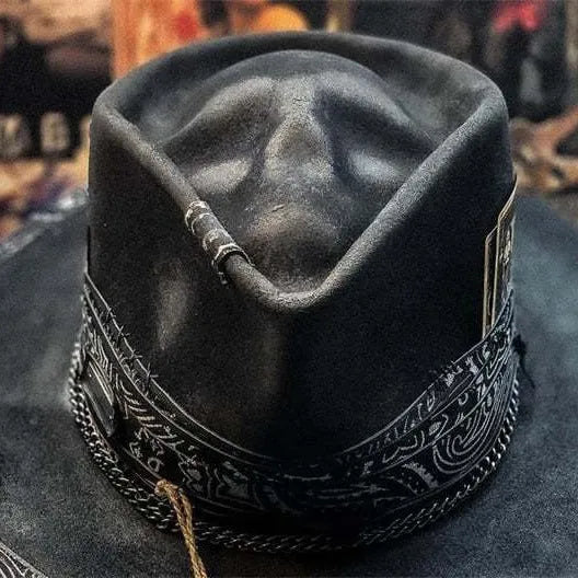 Handmade wool Halloween skull hat with a conical crown on a denim hat base.