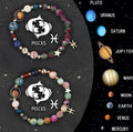 Twelve zodiac sign natural stone beaded bracelets with elasticated cord on wooden surface