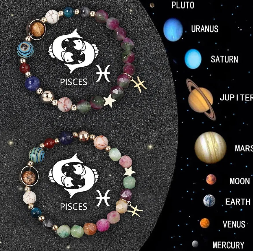 Twelve zodiac sign natural stone beaded bracelets with elasticated cord on wooden surface