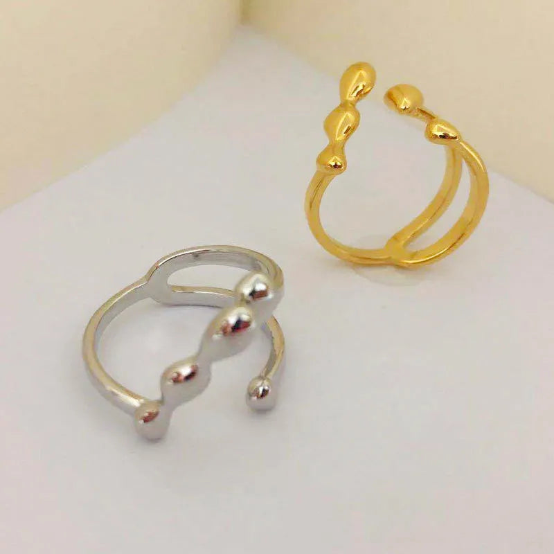 Brass women's ring with spherical design in gold and silver colour options