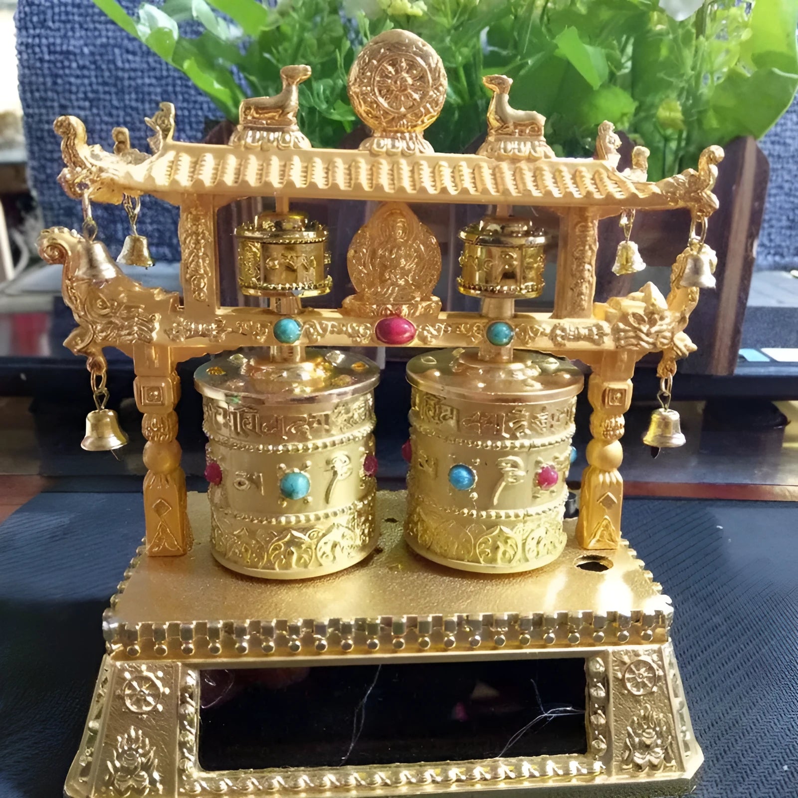Electric alloy prayer wheel car decoration with rotating mechanism on dashboard
