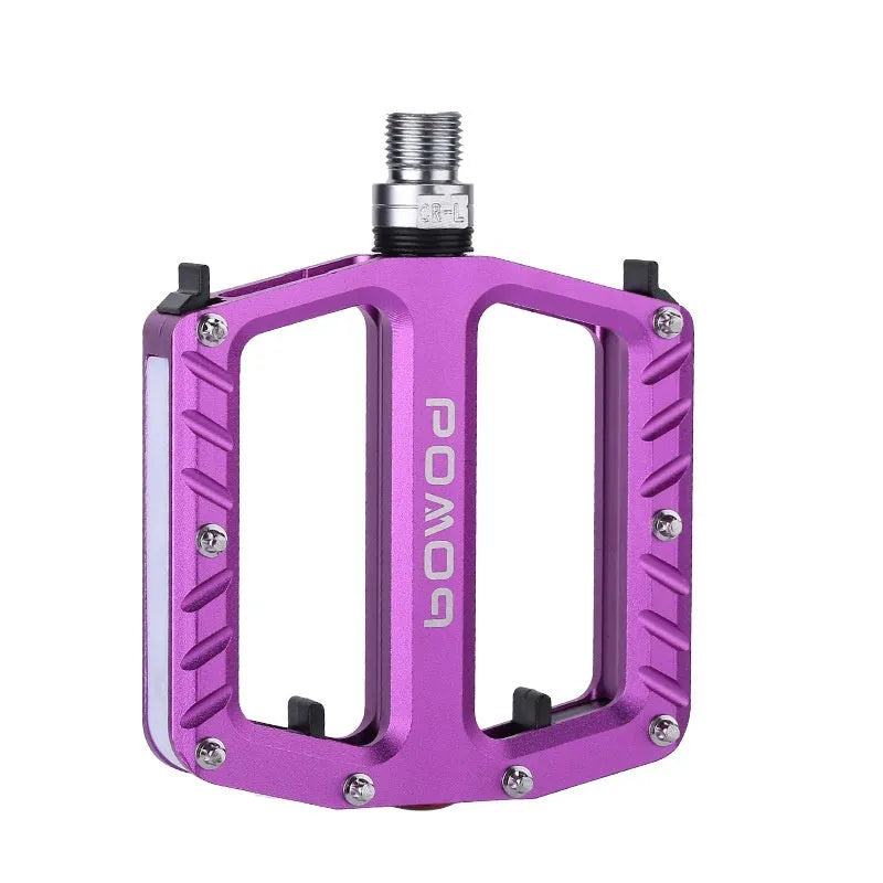 Aluminium alloy bicycle pedals with glowing 710 LED lights in purple, black, red, gold, and titanium colour options.