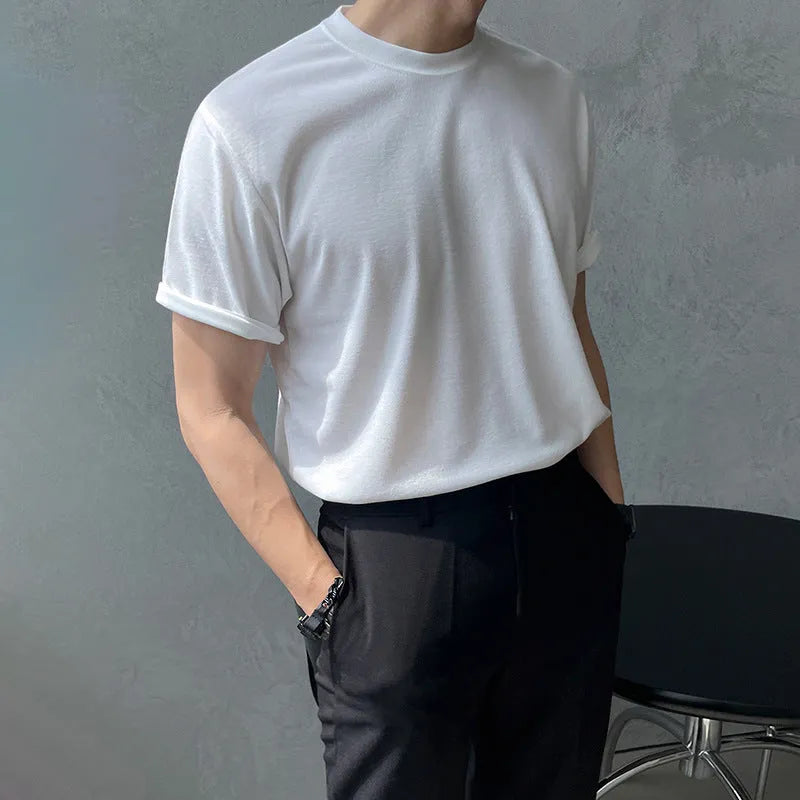 Men's slim fit cotton t-shirt in black, showing round neck and half-sleeve design.