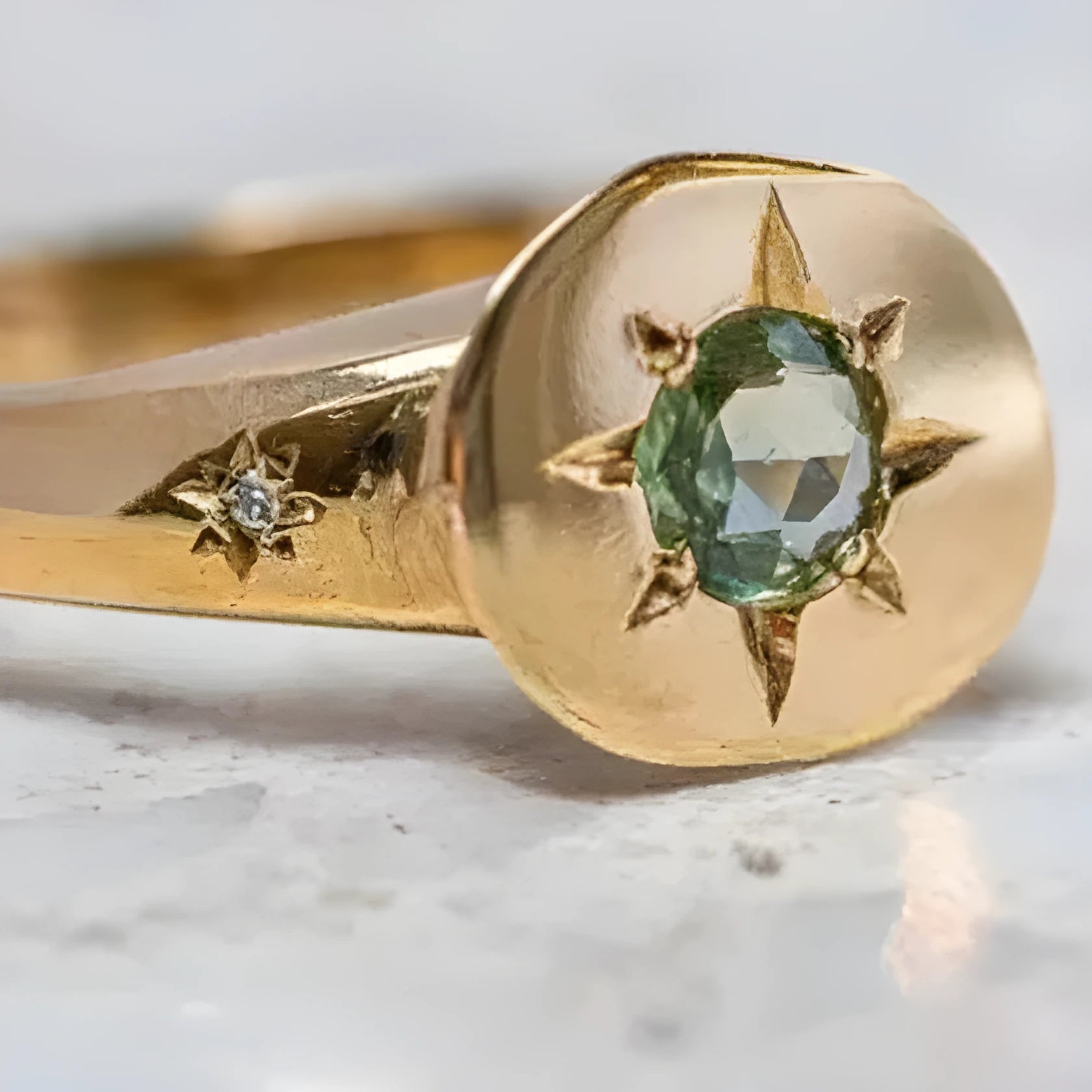 Gold star-shaped ring with asterism zircon on adjustable band.