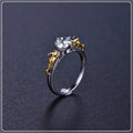 Copper crown cosplay ring with black gold finish and crystal details on a hand.