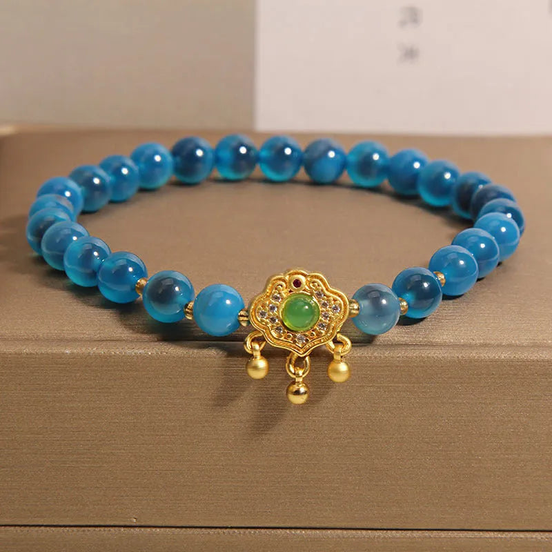 Women's blue agate safety lock pendant bracelet with crystal and rhinestone details