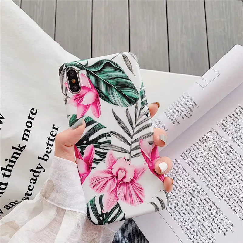 Pink floral design TPU phone case for iPhone on a table