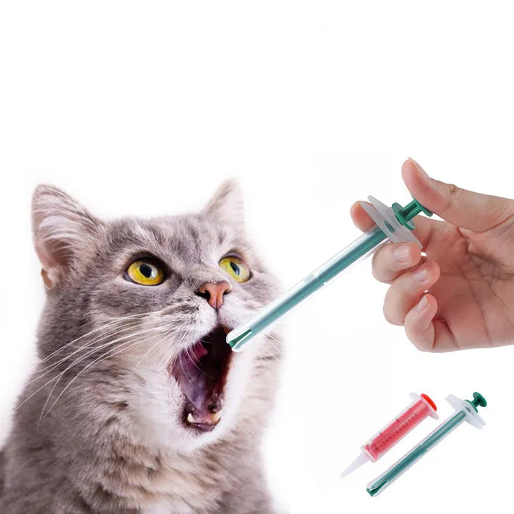 Two pet pill shooter guns with soft silicone tips for administering tablets to cats and dogs