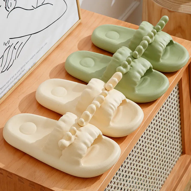 Women's deer horn design EVA flip flop slippers in light yellow colour on a white background.