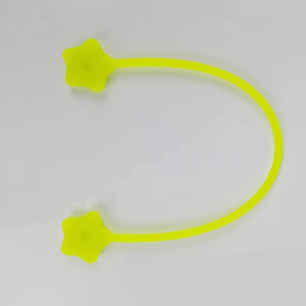 Small silicone magnet wire winder in purple organizing a headphone cable
