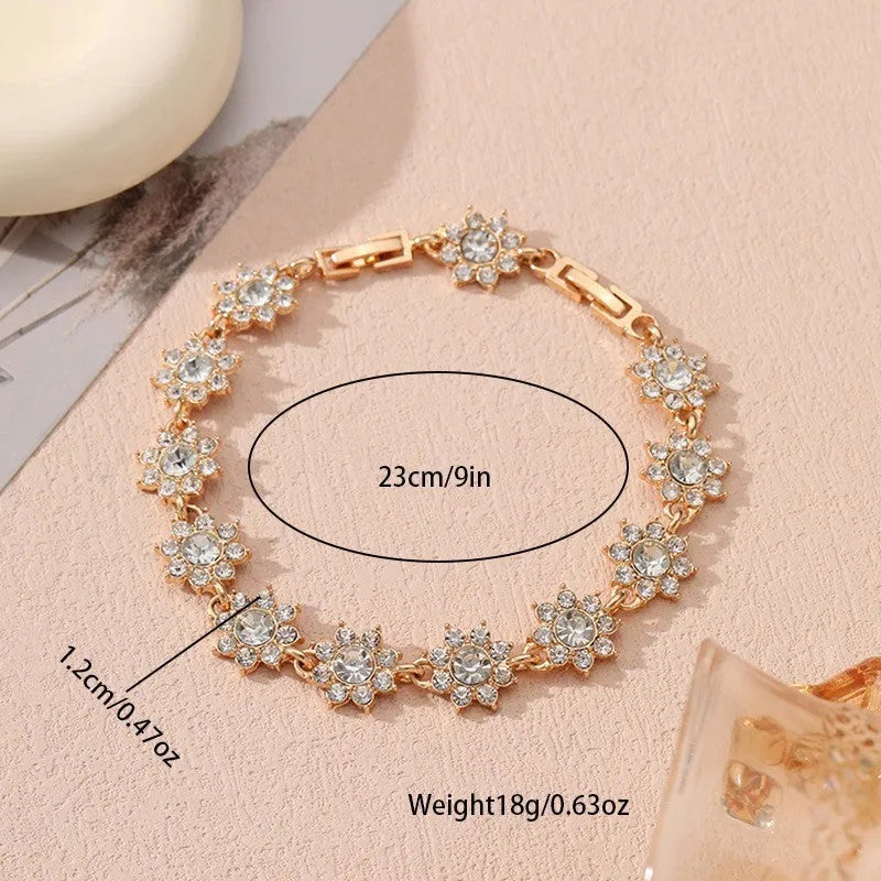 Close-up of a floral-shaped zinc alloy bracelet with an electroplated finish and crystal details.