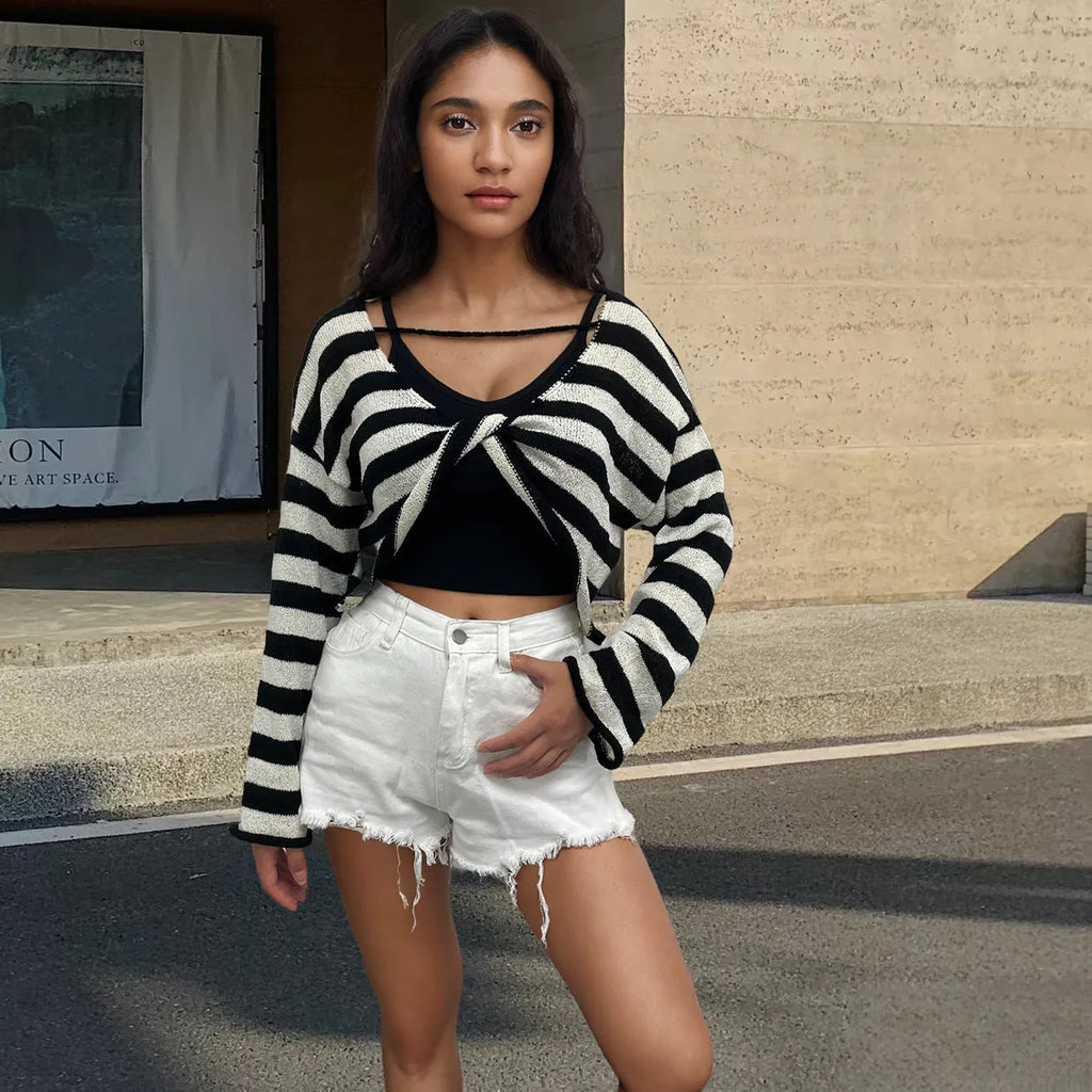 Striped long-sleeved sweater showing front and back wearable design with exposed navel detail