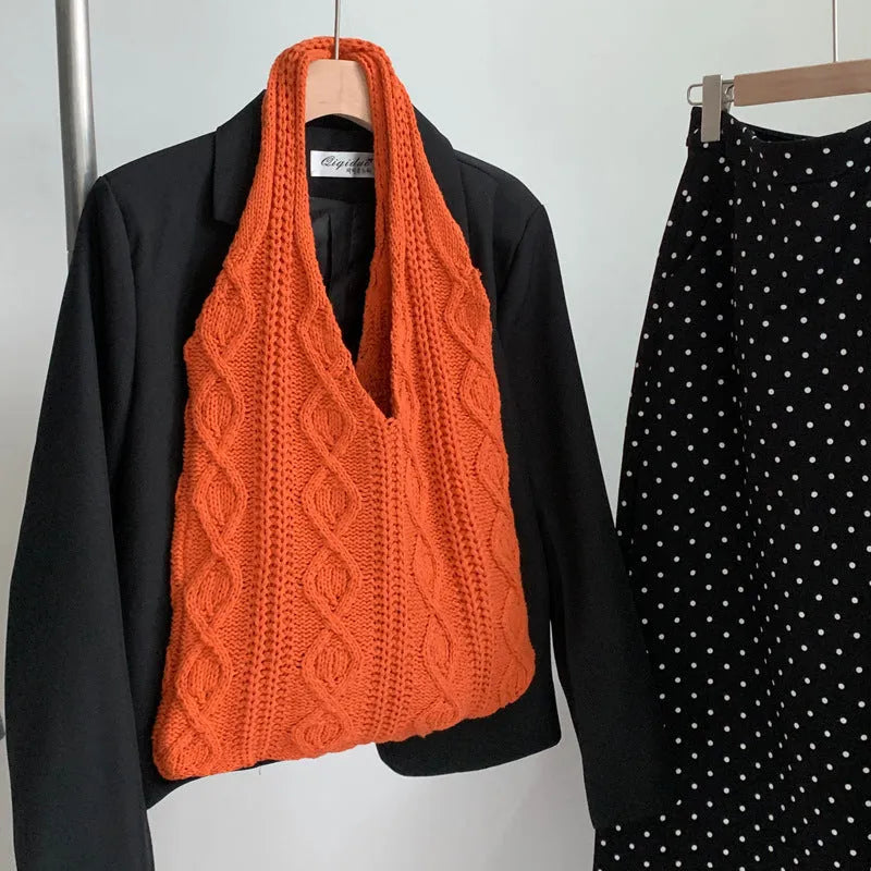 Women's retro style hollow knitted polyester tote bag in a solid colour, showing large open top and textured yarn material.