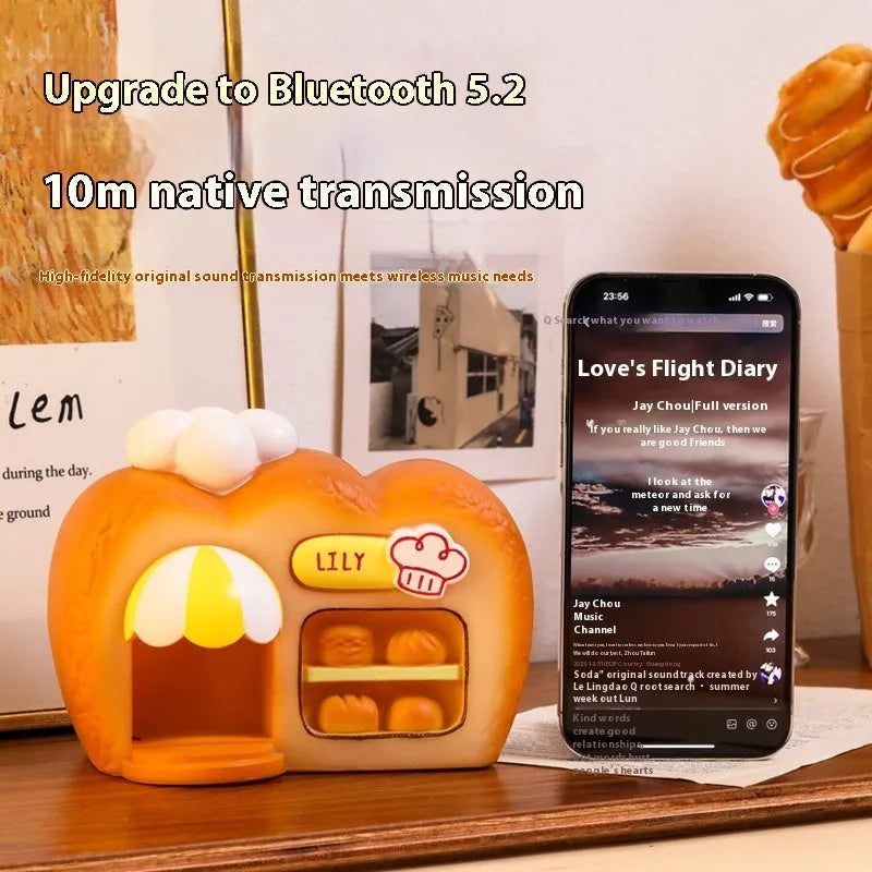 White ABS bakery Bluetooth speaker with glowing ornament design and 50mm driver