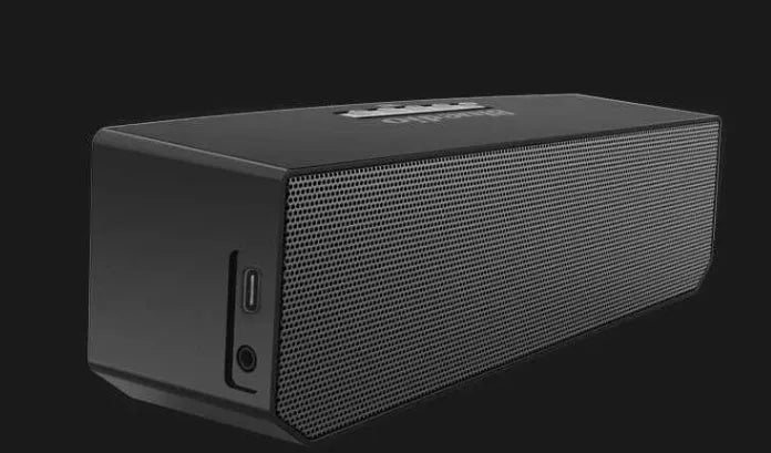 BS-6 black compact rectangular Bluetooth smart speaker on a surface.