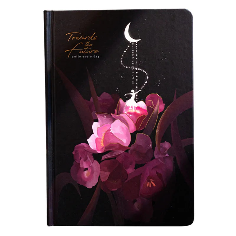 A5 notebook with luminous cover open to show pages filled with colour illustrations