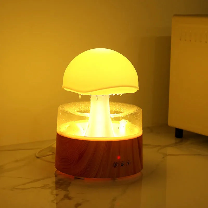 White cloud-shaped ultrasonic humidifier and aroma diffuser with simulated rain drops and coloured light.