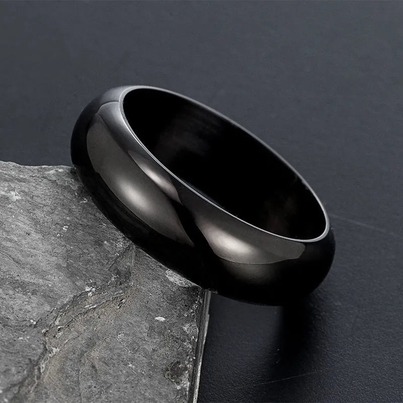 Glossy electroplated titanium steel ring in gold, black, and steel colour options showing polished finish