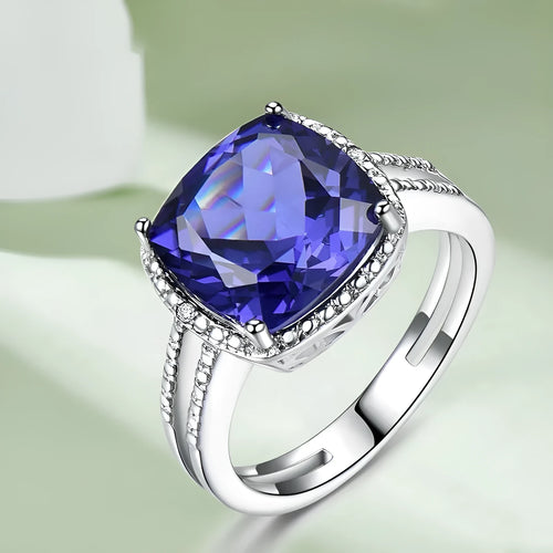 Blue tanzanite stone set in a sterling silver women's ring.