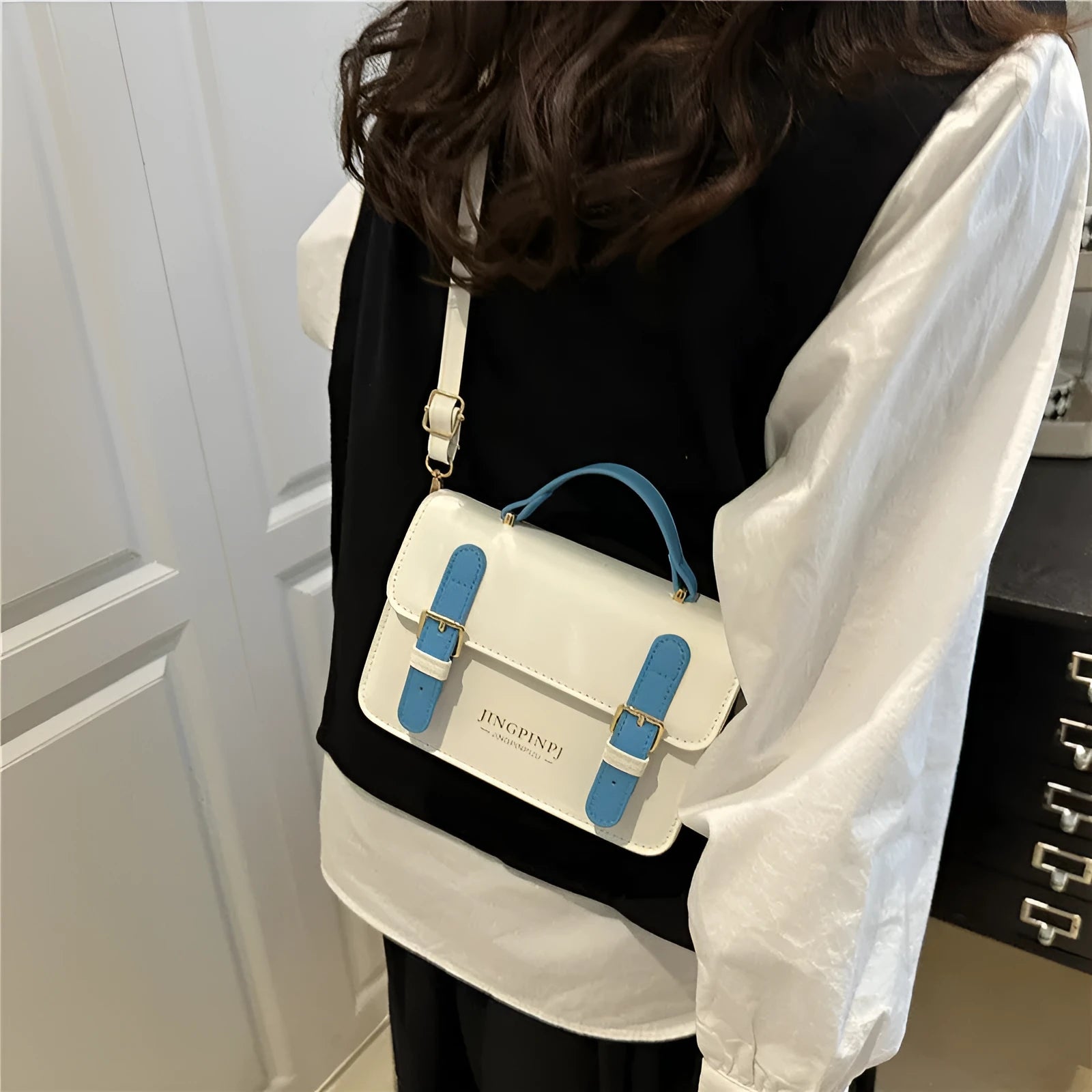 Women's PU square shoulder bag in black with sandwich pocket and strap