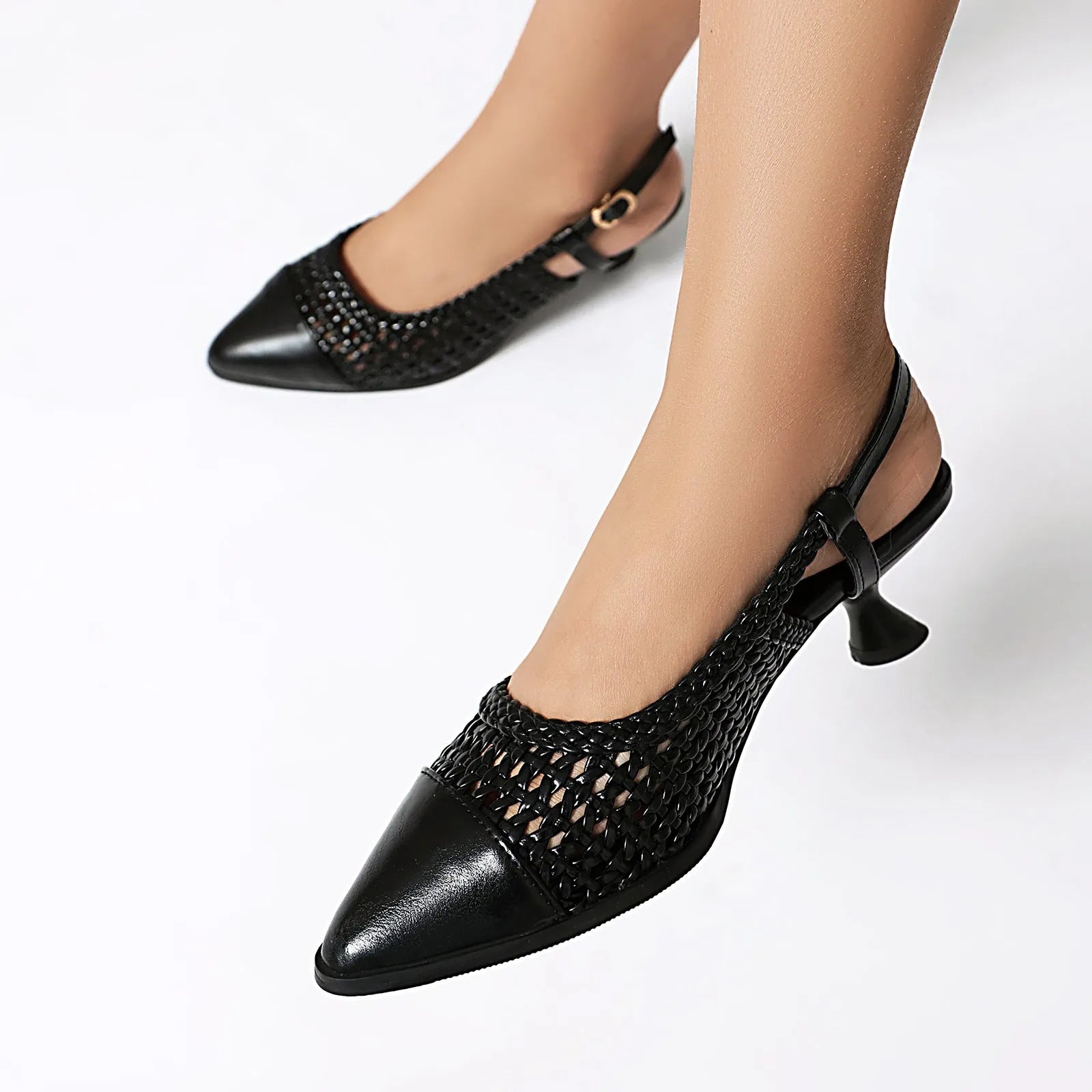 Women's black cat heel sandals with a buckle strap and pointed toe, shown on a light background.