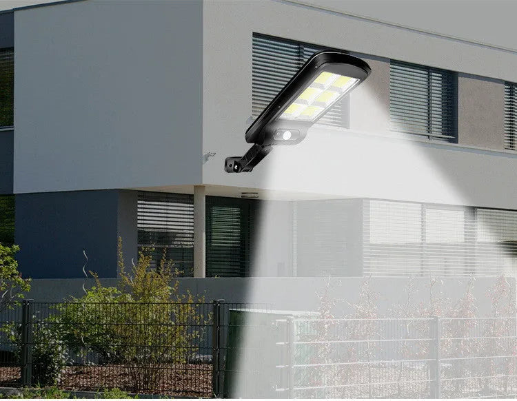 Black solar motion sensor street light for outdoor garden and pathway security lighting