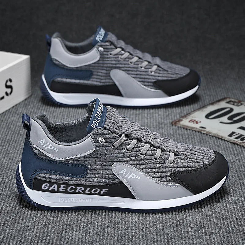 Men's green and grey low-top mesh running shoes with round toe and lace-up front.