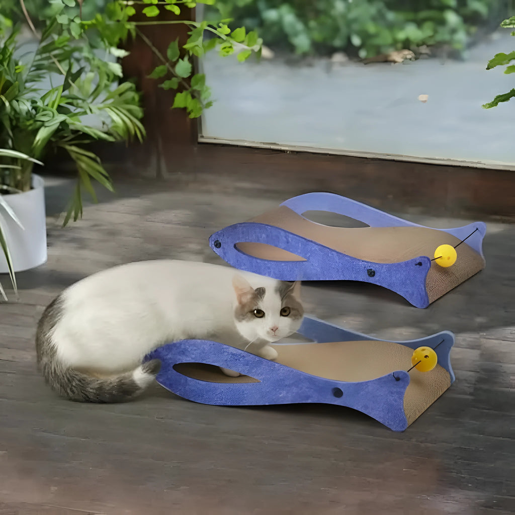 Blue fish-shaped corrugated cardboard cat scratcher lounge with bell ball toy attached.