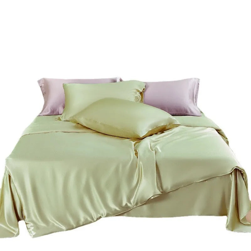 Solid colour silk duvet cover laid flat, showing double-sided construction and smooth texture.