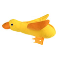 Yellow plush dog toy with attached rubber duck and a treat slot on a white background.