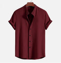 Men's loose fit short sleeve polyester shirt in multiple colours on a size chart background.