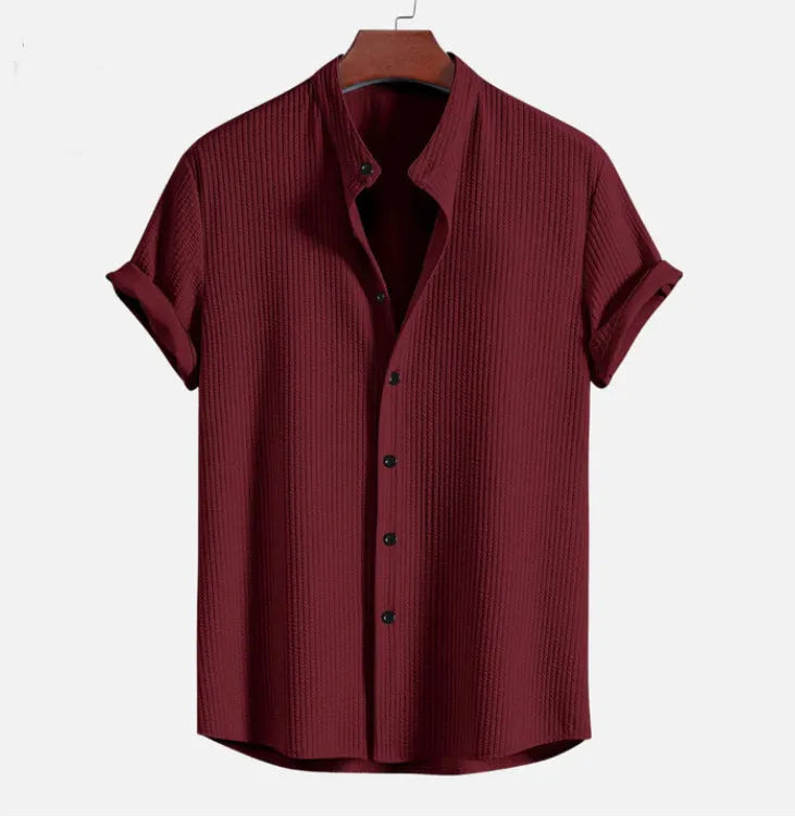 Men's loose fit short sleeve polyester shirt in multiple colours on a size chart background.