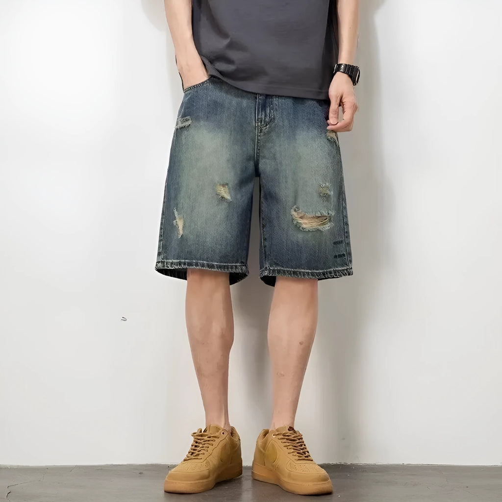 Men's blue retro wash loose fit denim shorts with straight legs on a mannequin.