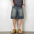 Men's blue retro wash loose fit denim shorts with straight legs on a mannequin.