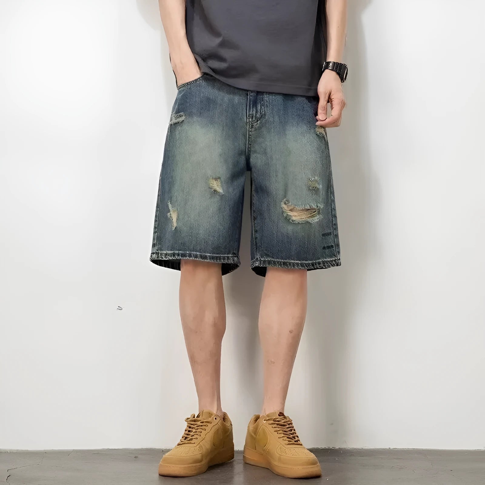 Men's blue retro wash loose fit denim shorts with straight legs on a mannequin.