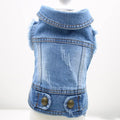 Dark denim dog vest with a retro scratch pattern print on the front, modelled on a small dog.