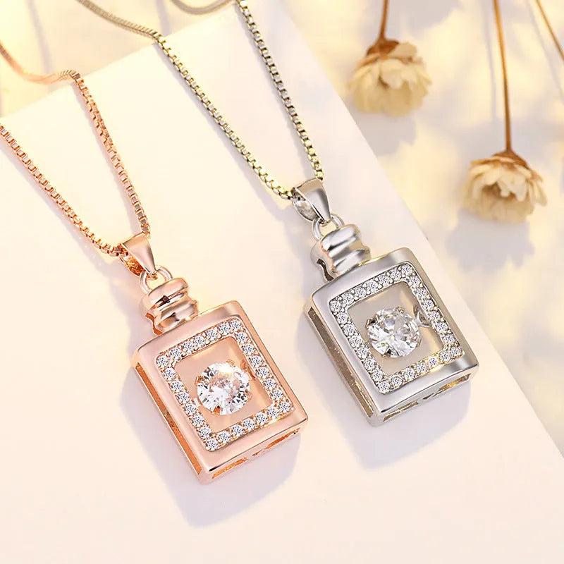 Sterling silver heart pendant necklace with crown and bow detailing in rose gold or silver finish