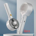Ceramic white pet grooming brush with spray nozzle, UVC blue light, and fine needles for dogs and cats.