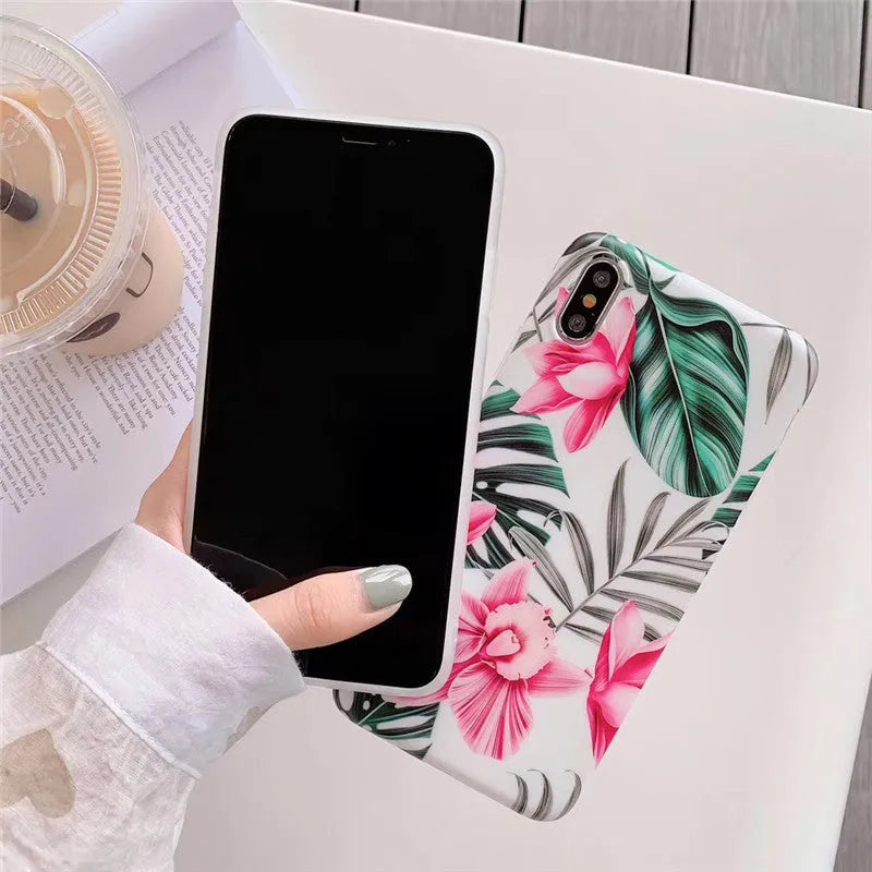 Pink floral design TPU phone case for iPhone on a table
