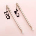 Gel pen with paper crane pendant charm showing 0.38mm tip and 17cm plastic barrel