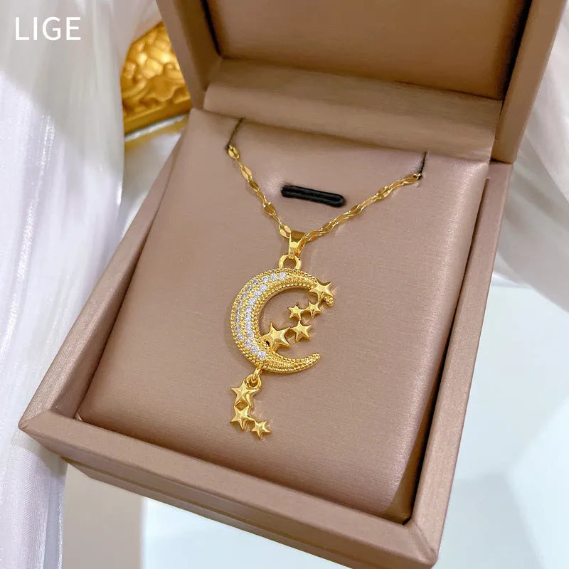 Geometric moon pendant necklace with tassel detailing and diamond accents on copper