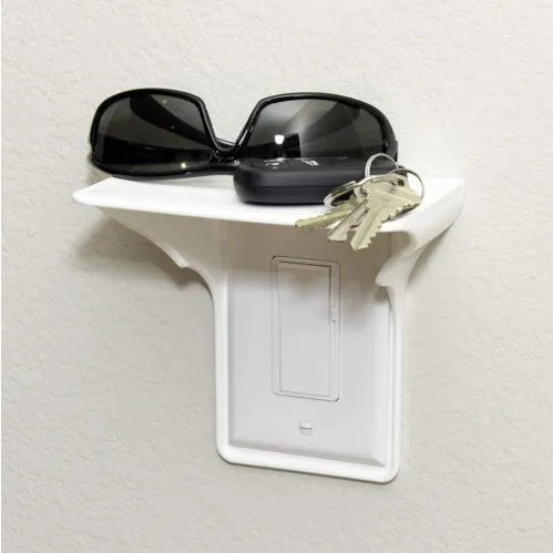 White plastic socket storage rack with clear removable compartments on wall mount