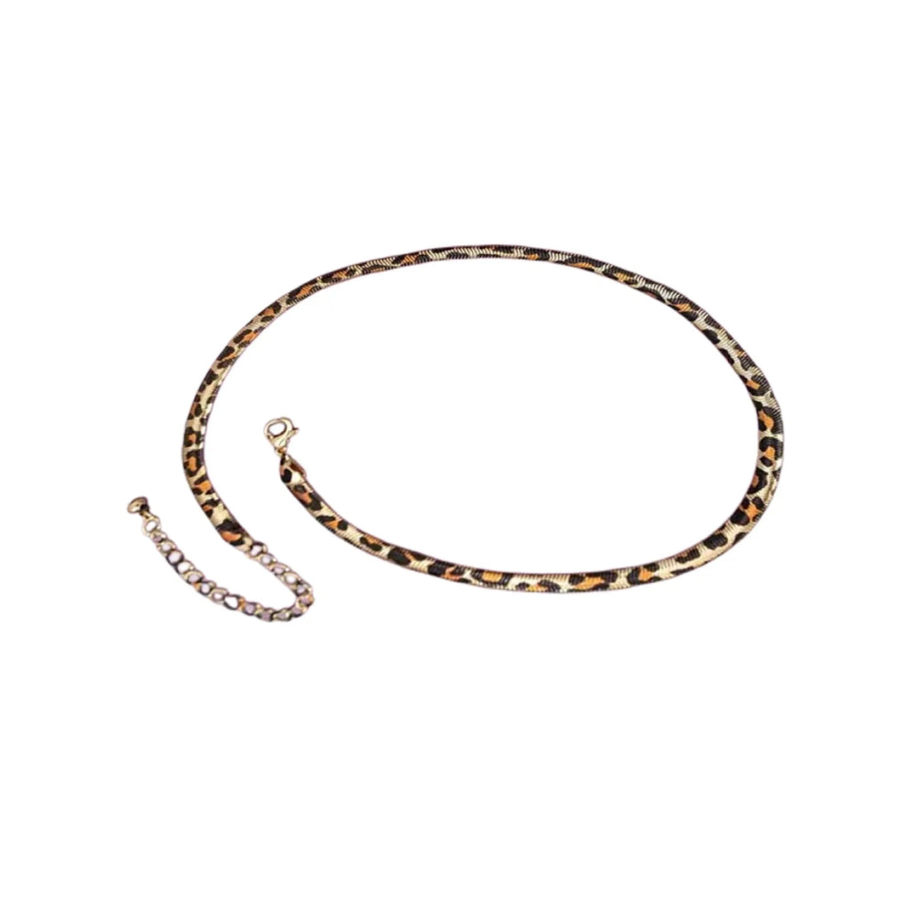 Women's alloy leopard necklace with leopard print motif against a neutral background