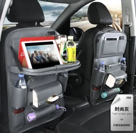PU leather car storage hanging bag with multiple pockets attached to car seat back
