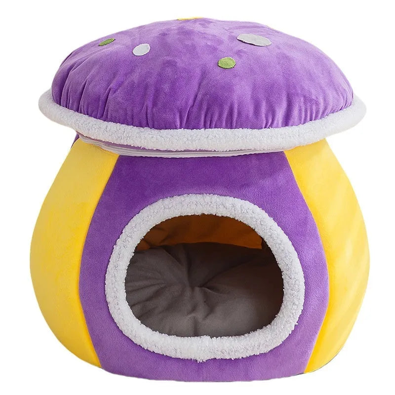Purple mushroom-shaped plush cat nest with a detachable blanket, shown on a wooden floor.