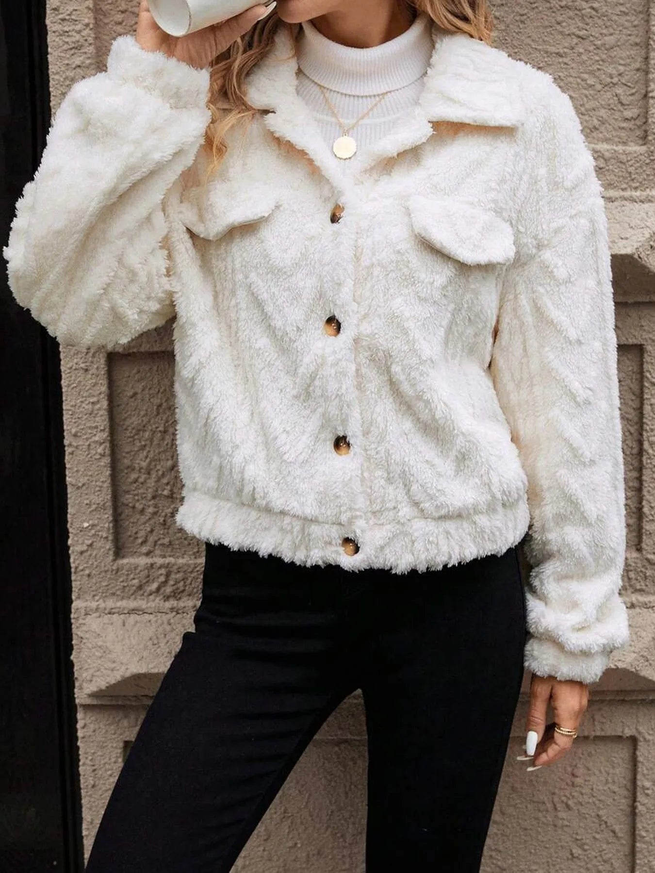 Ivory white women's plush button cardigan with regular sleeves on hanger