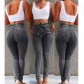 Women's fringed jeans in distressed Cowboy denim with frayed hem detailing in grey, dark blue, or light blue