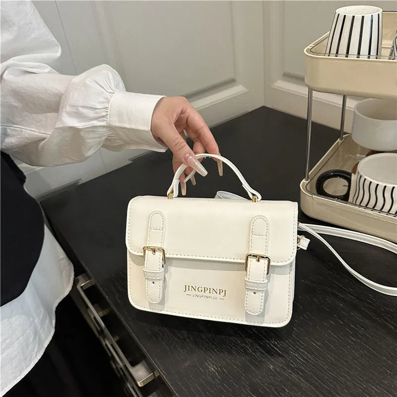 Women's PU square shoulder bag in black with sandwich pocket and strap