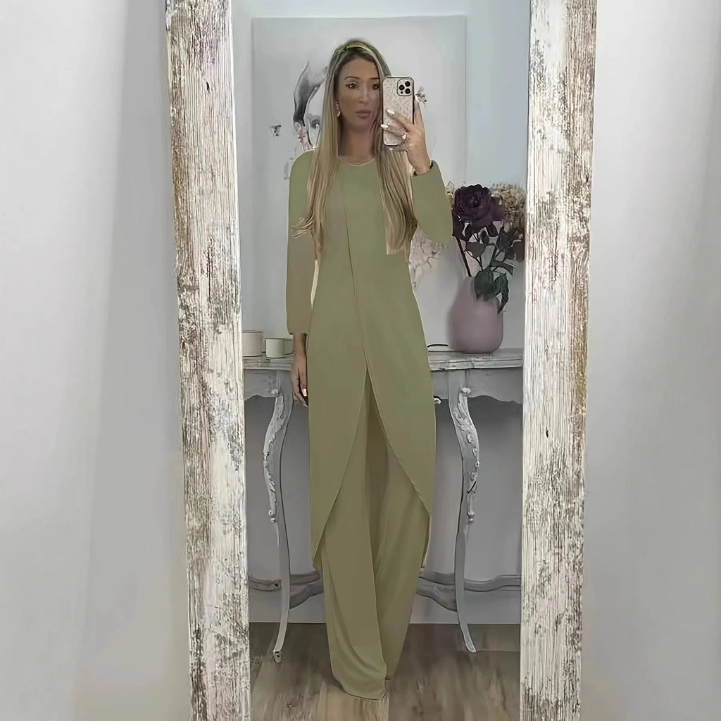 Women's black polyester two-piece lounge set with long sleeve top and loose trousers on a hanger.