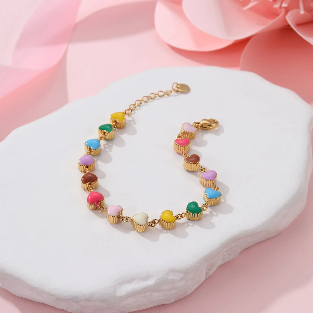 Women's stainless steel bracelet with love heart pendant in gold or steel finish